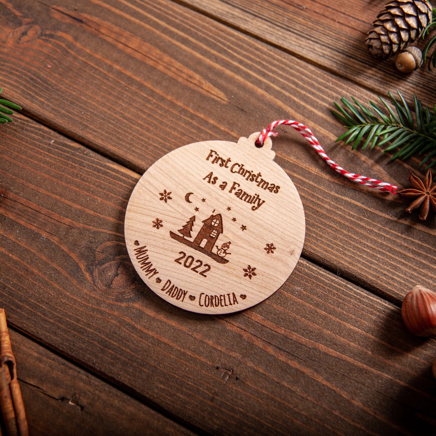 Rustic wooden ornament personalised for first Christmas as a family