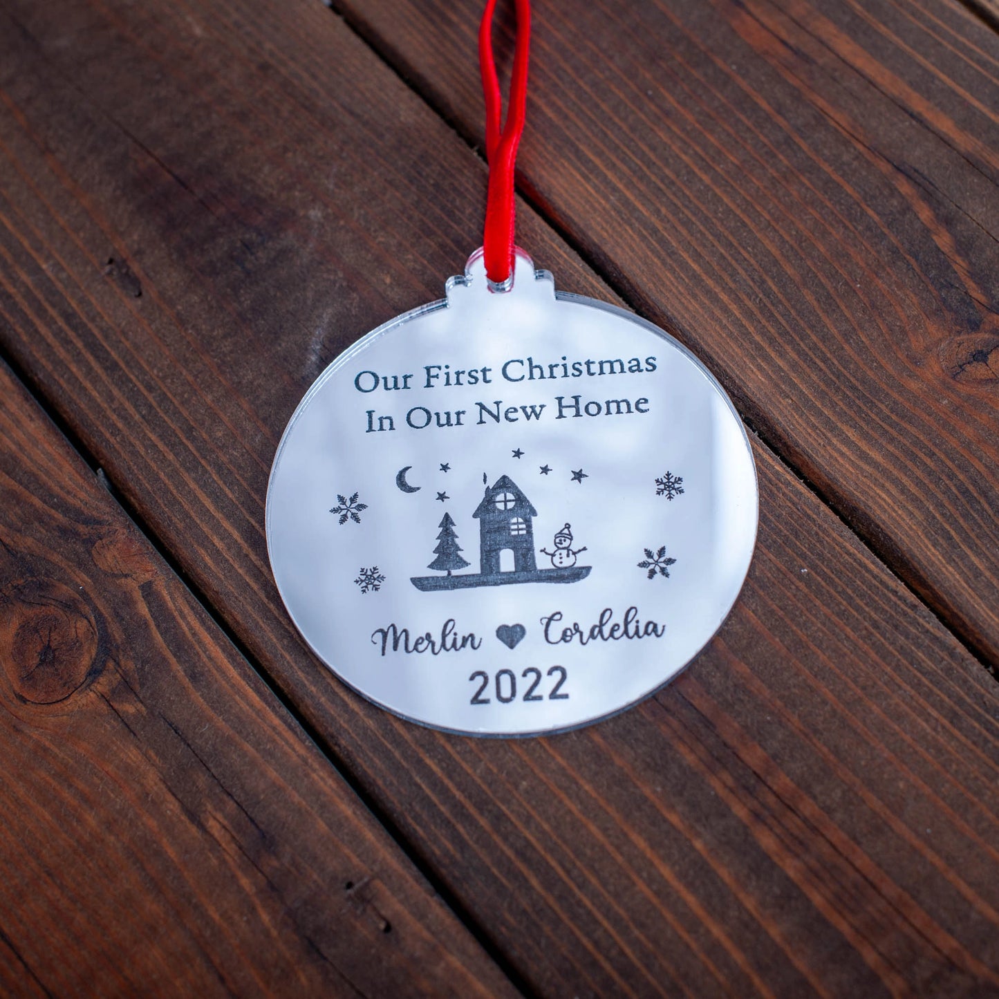 Elegant reflective silver Christmas bauble engraved with family name
