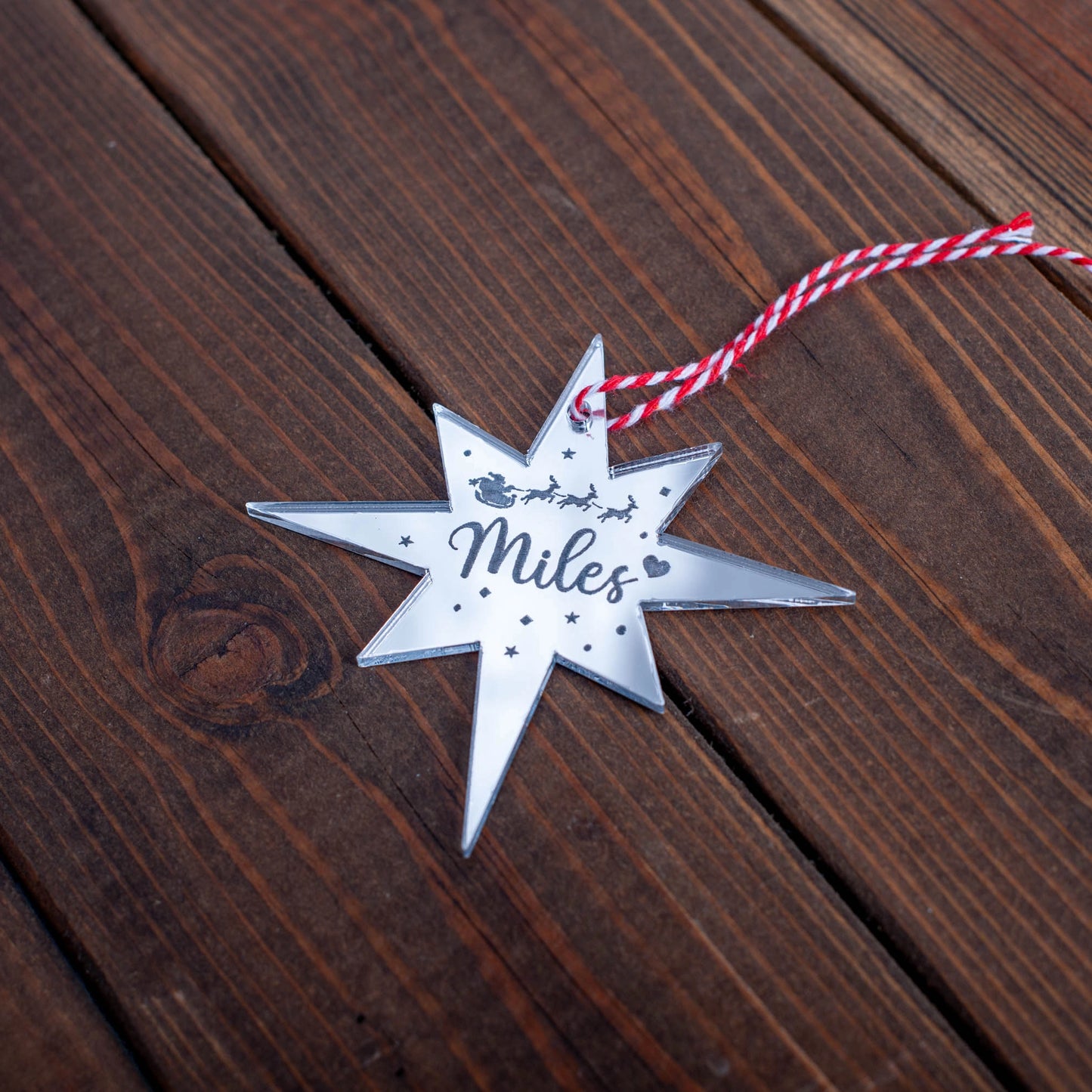 Laser-cut personalised Polaris Christmas decoration with ribbon