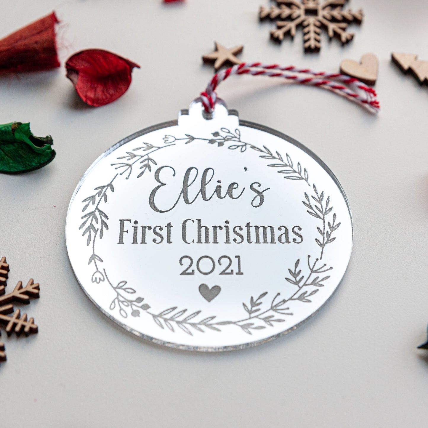 Reflective silver acrylic bauble personalised for baby’s first Christmas
