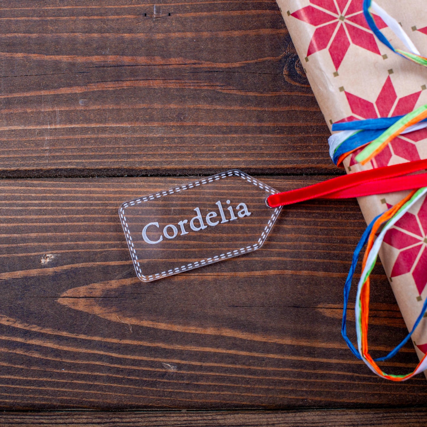 Minimalist transparent Christmas tag engraved with custom text