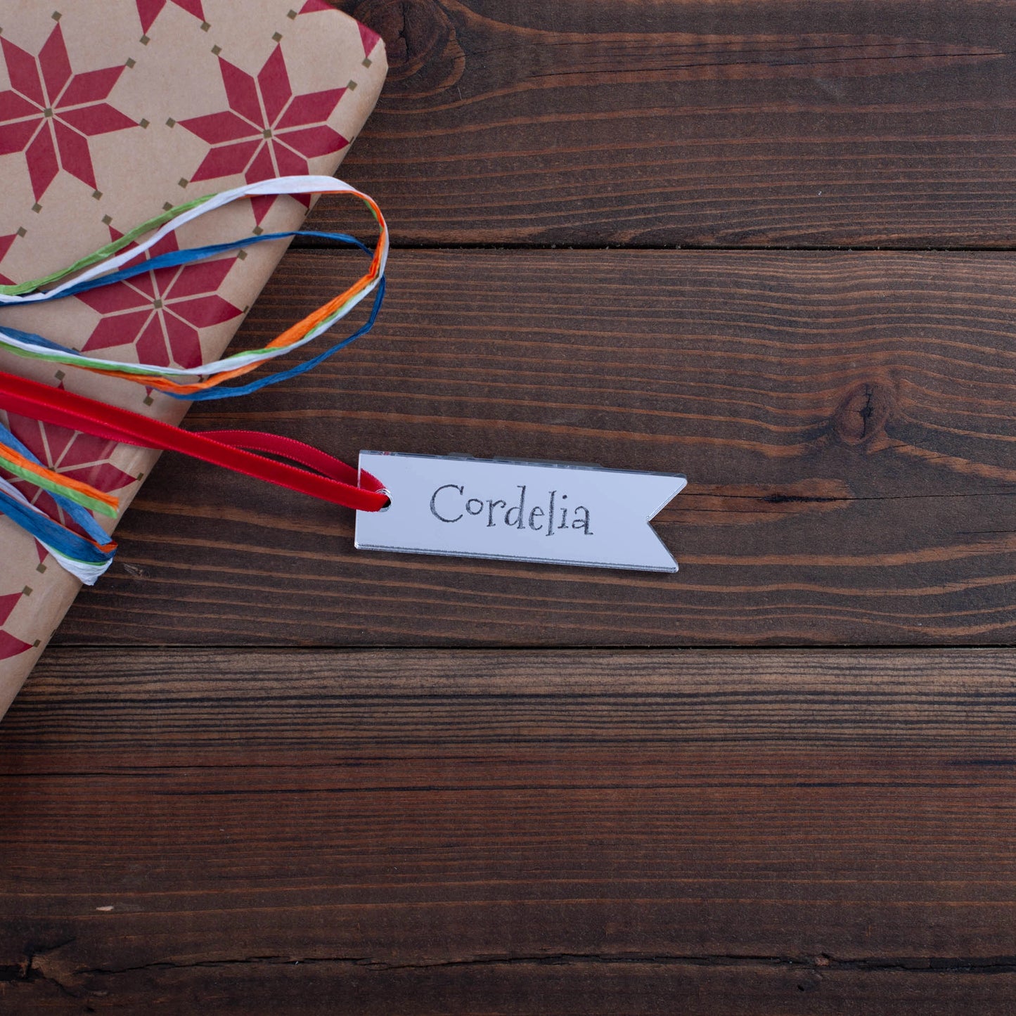 Reusable personalised silver mirror tag with engraved text and twine