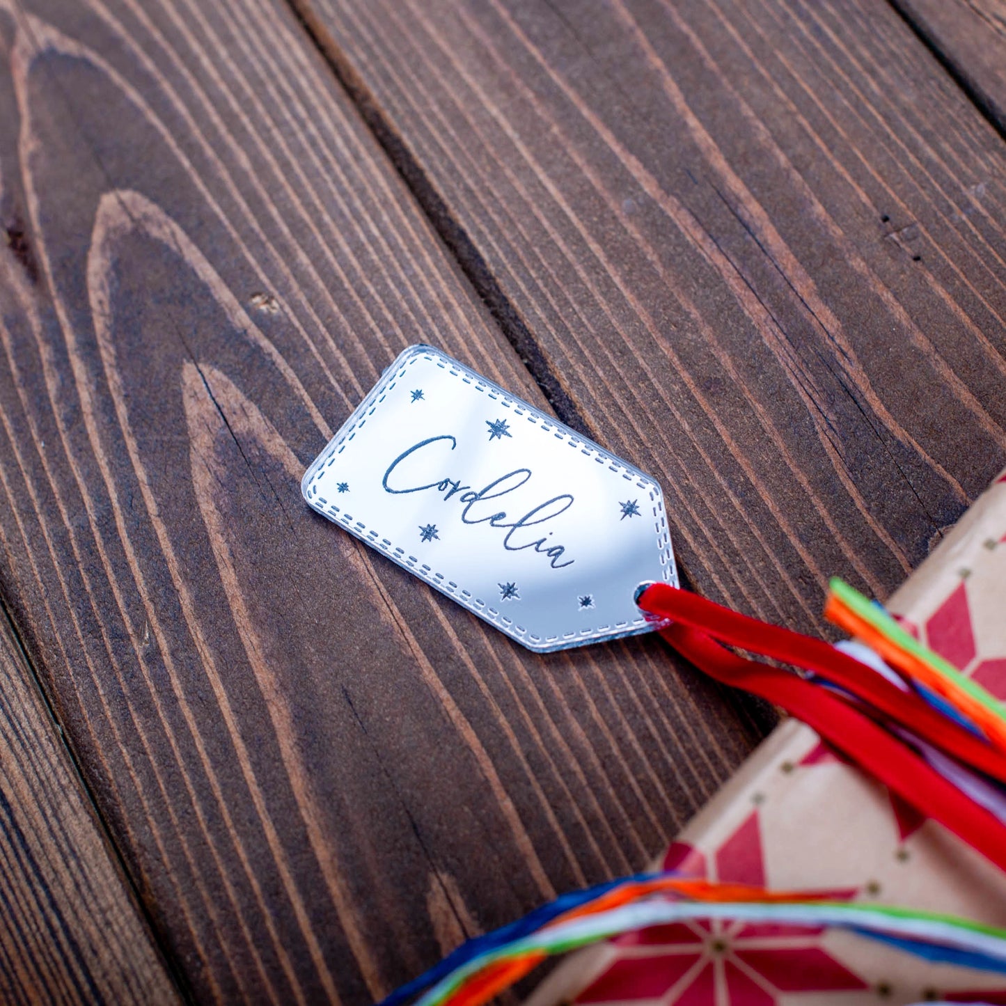 Engraved stars design on silver mirror name tag