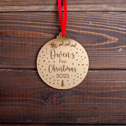 Gold mirror baby’s first Christmas bauble with engraved sleigh design