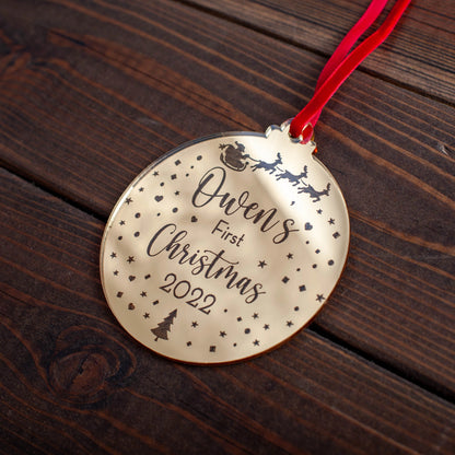 Baby’s first Christmas ornament engraved with Santa sleigh and name