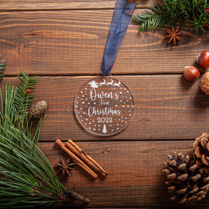 Acrylic baby ornament featuring engraved Santa sleigh design