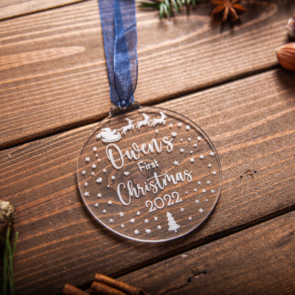 Custom acrylic baby ornament engraved with Santa and sleigh motif