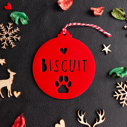 Personalised red acrylic paw ornament with engraved pet name