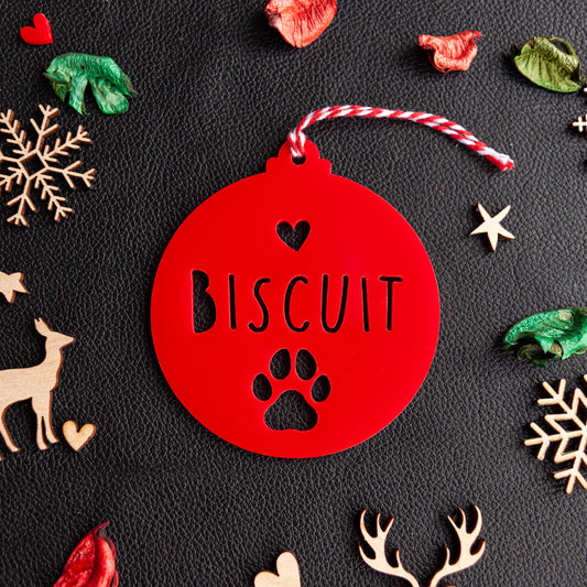Personalised red acrylic paw ornament with engraved pet name