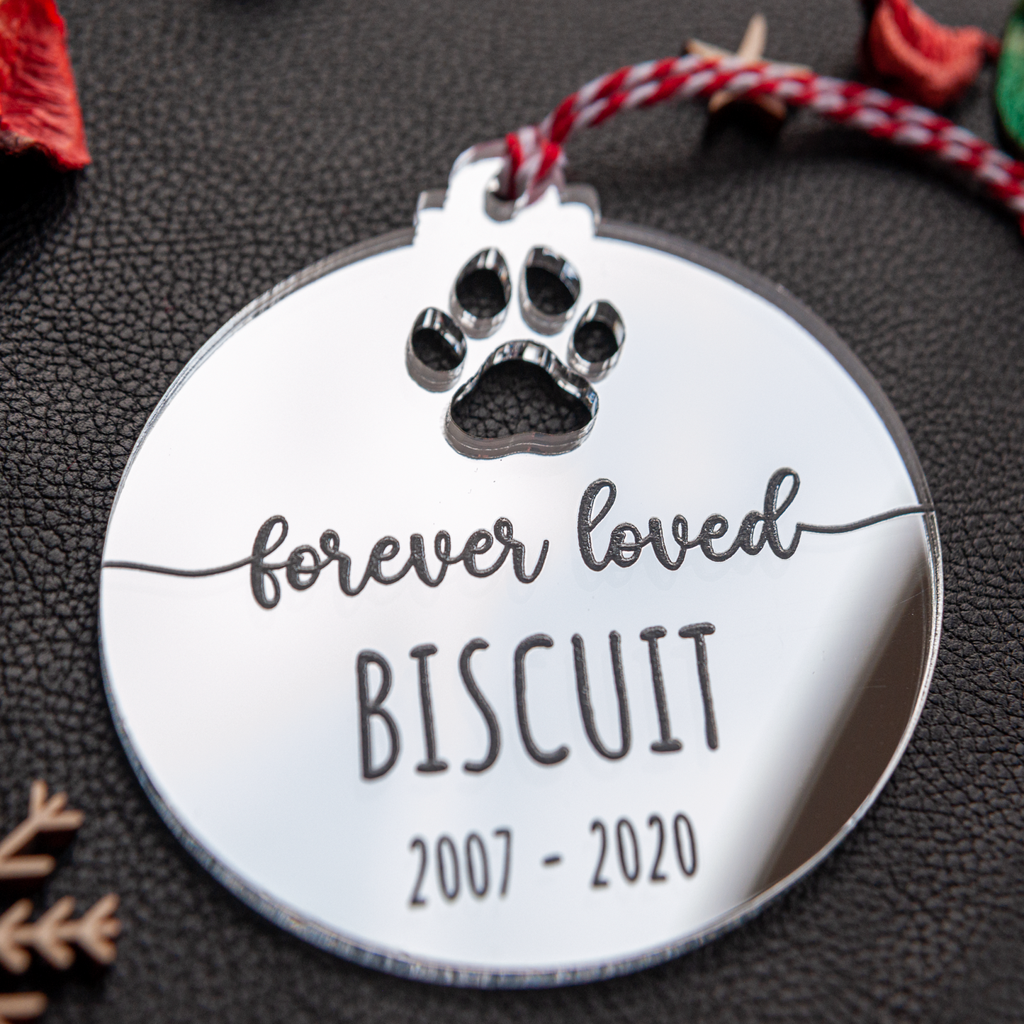 Engraved silver mirror pet memorial bauble with pet name and paw print