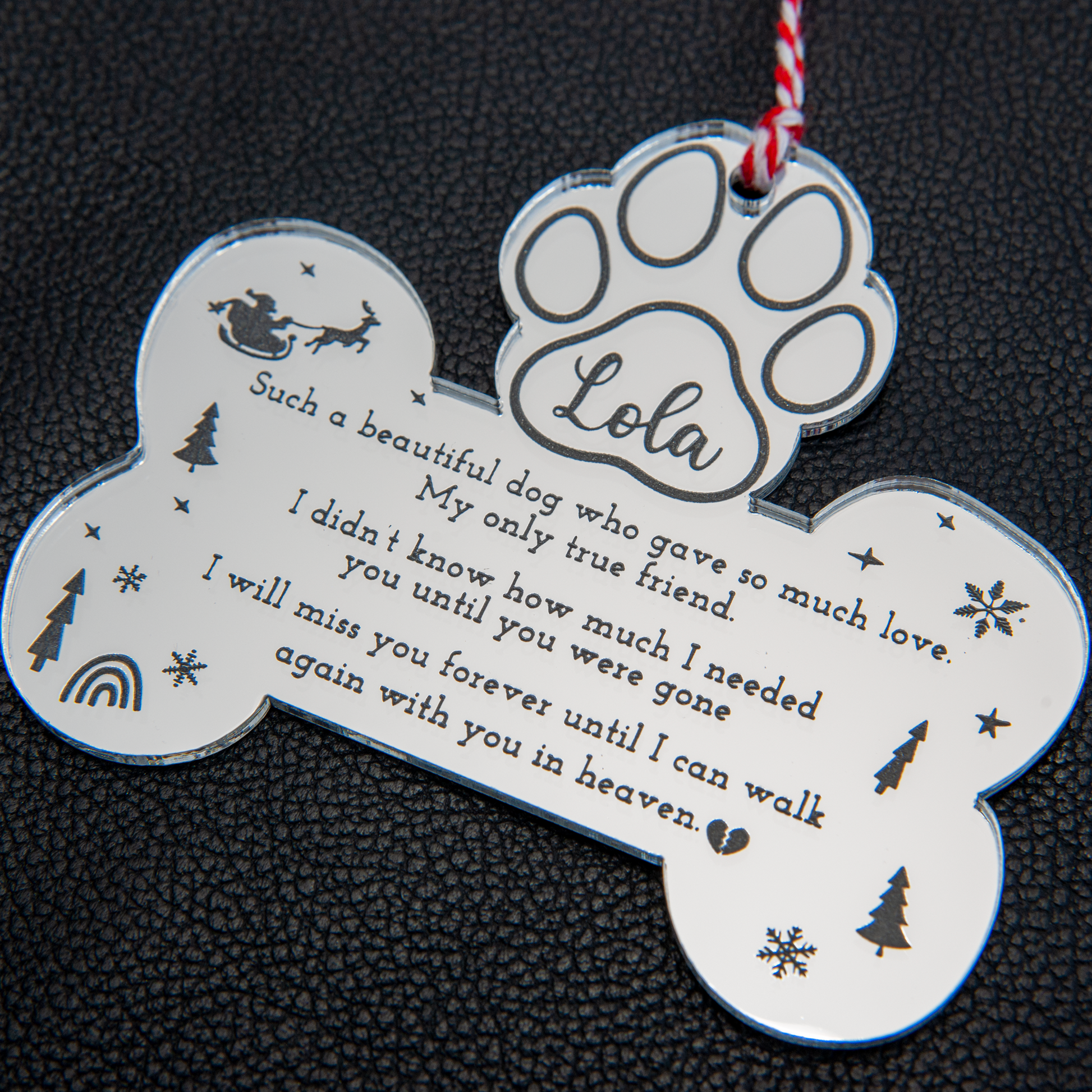 Personalised pet memorial Christmas bauble with engraved name and paw print