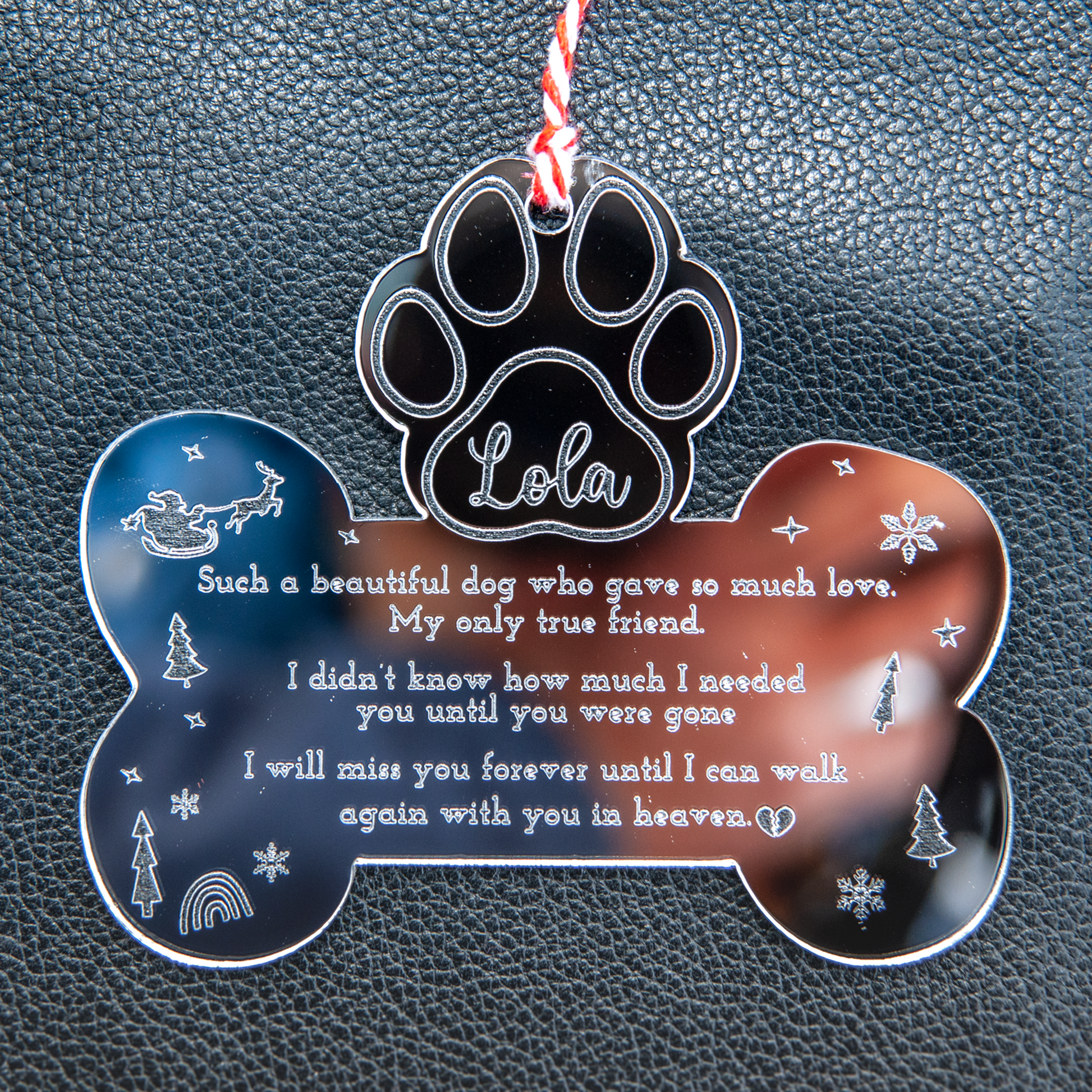 pet memorial ornament with name engraving and red and white twine