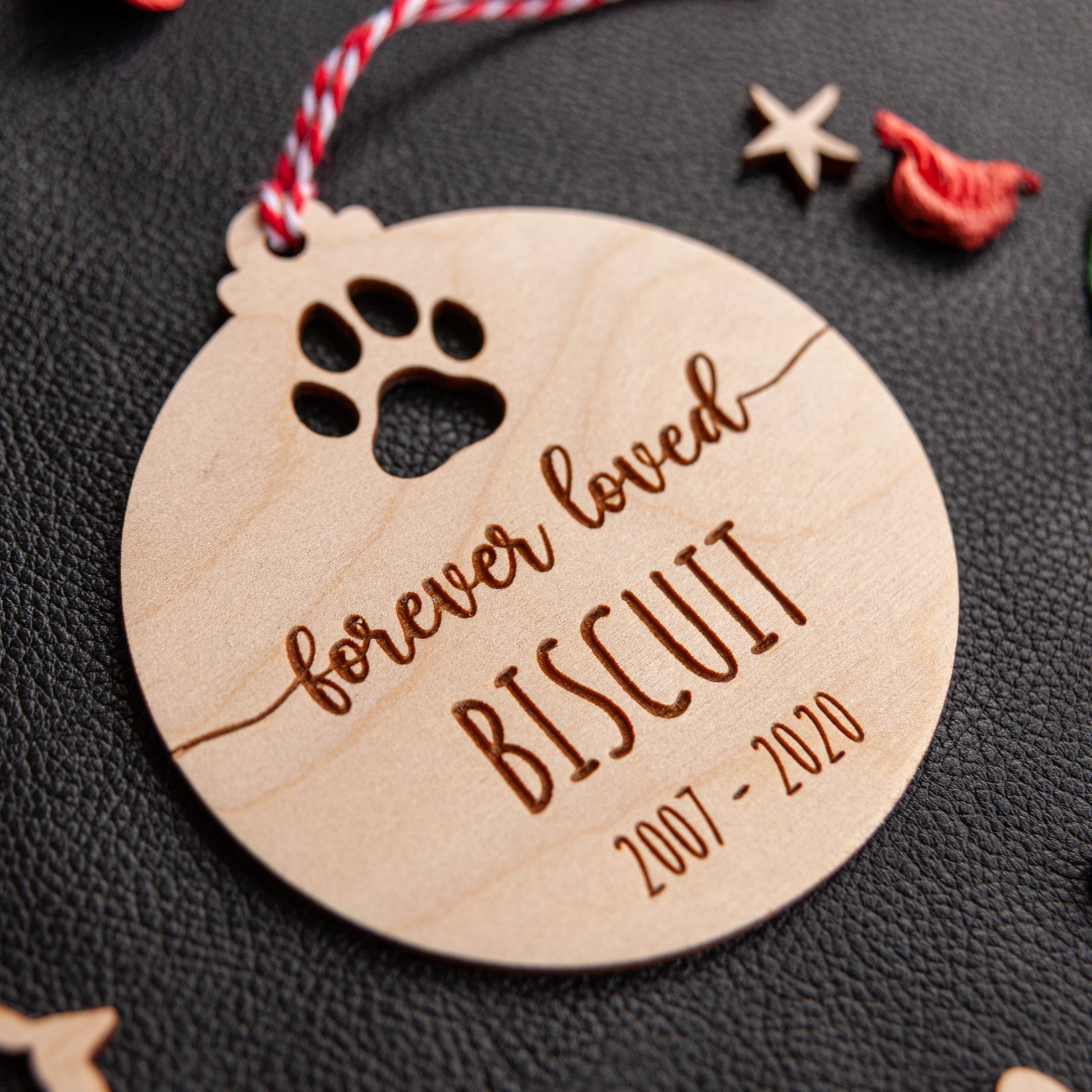 Wooden paw print memorial bauble for dogs and cats