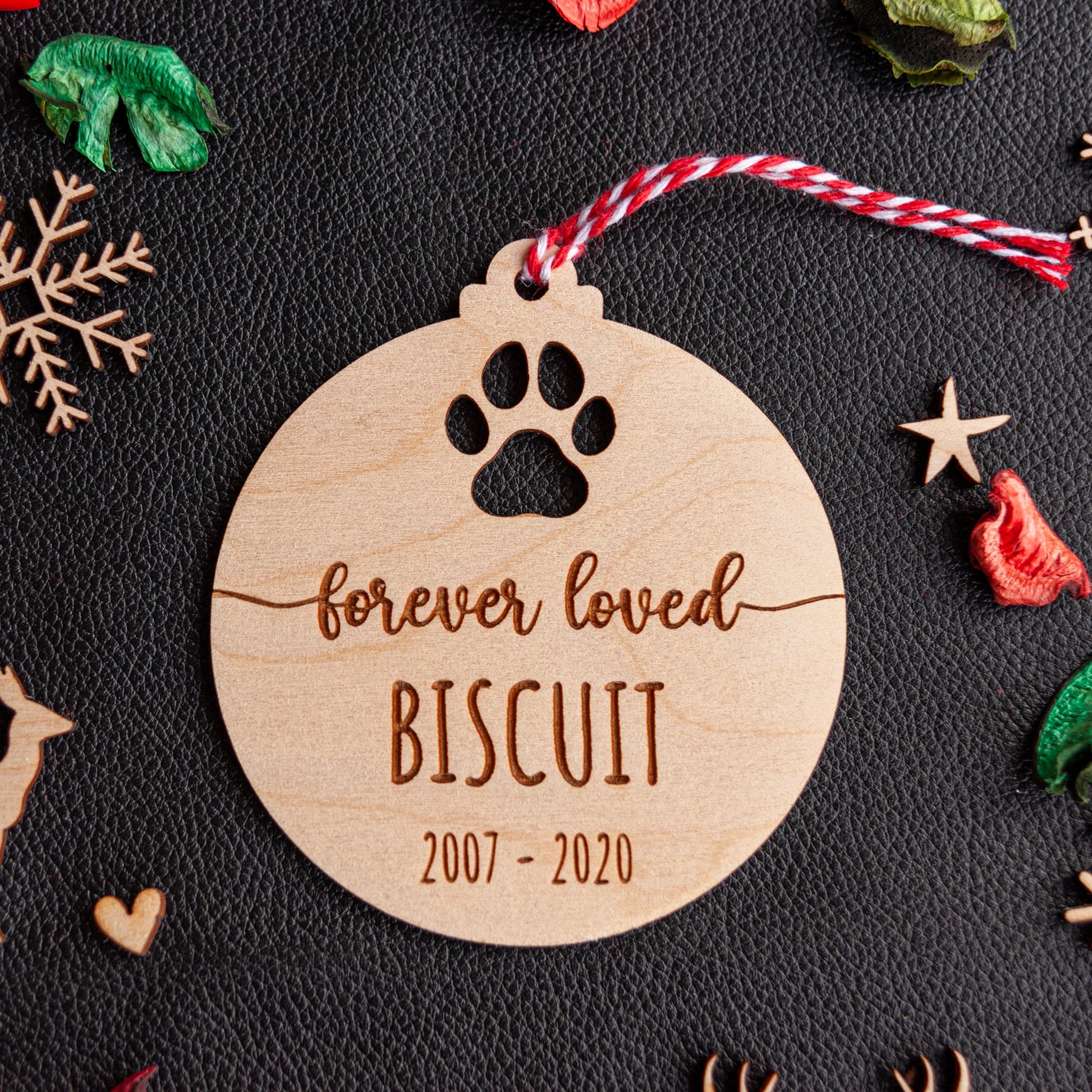 Personalised pet memorial bauble engraved on natural wood