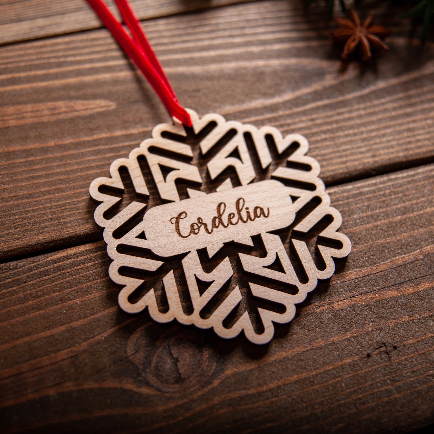 Custom name snowflake bauble close-up showing engraved details