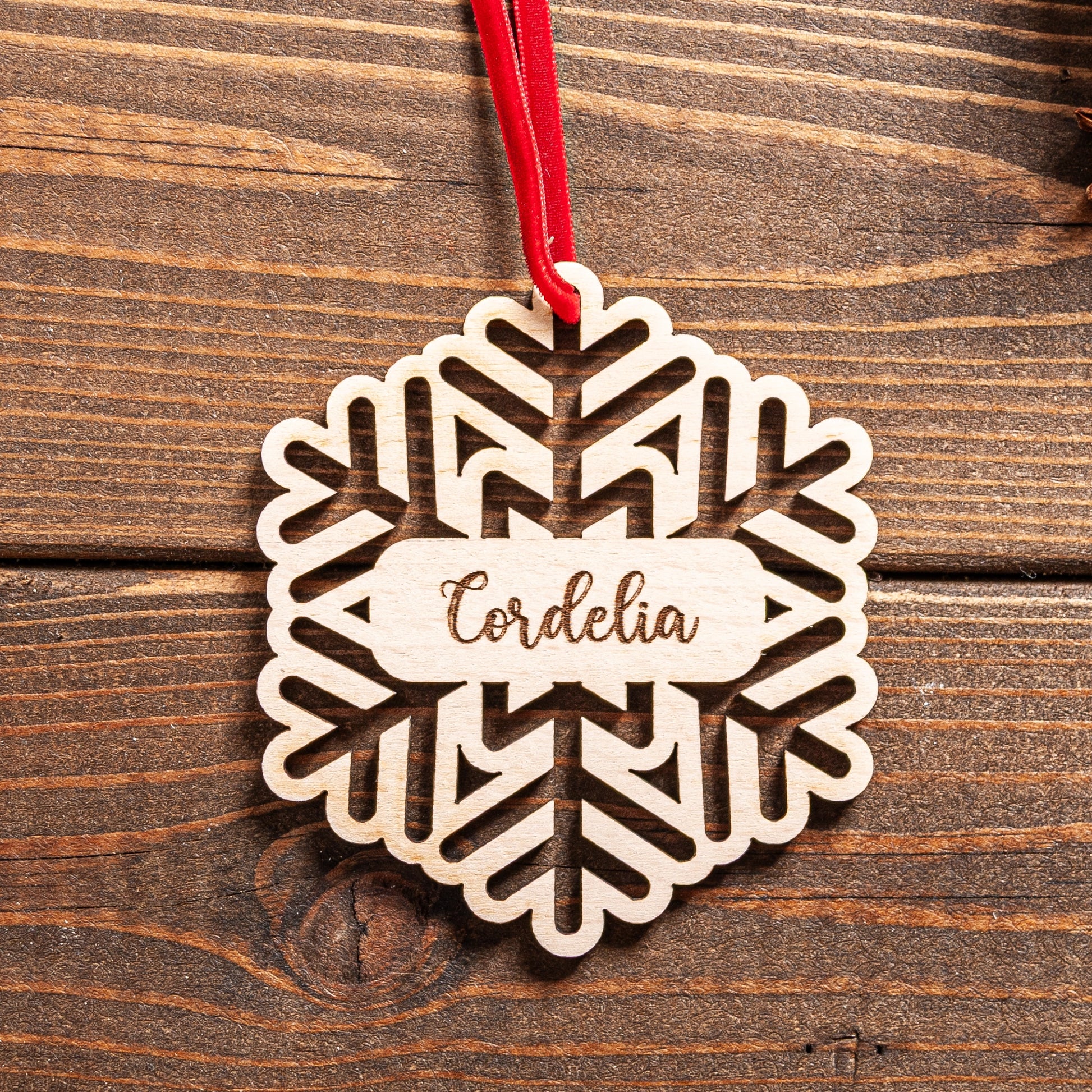 Rustic wooden Christmas bauble with twine ribbon ready to hang