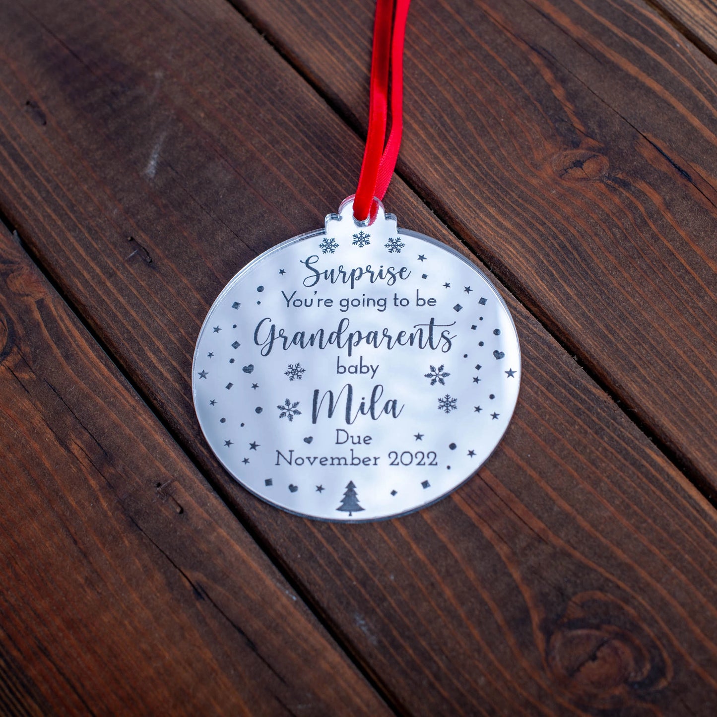Custom engraved ornament with “You’re going to be grandparents” message