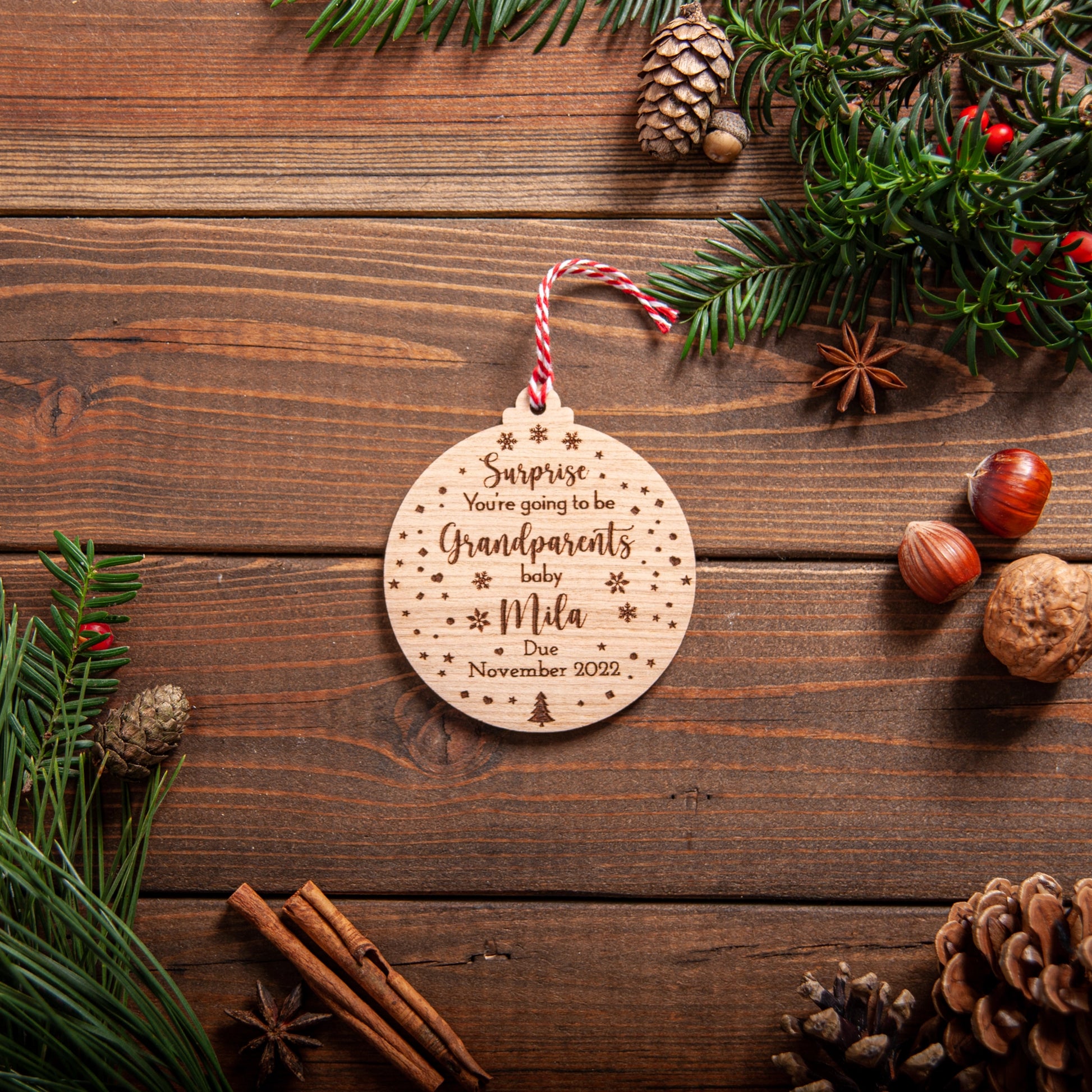 Personalised wooden baby reveal bauble with due date and ribbon