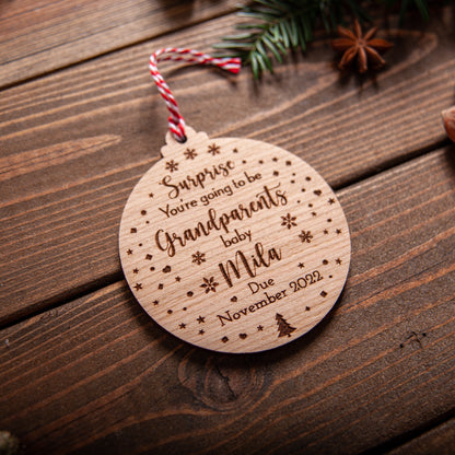 Custom engraved pregnancy reveal bauble for grandparents hanging on tree