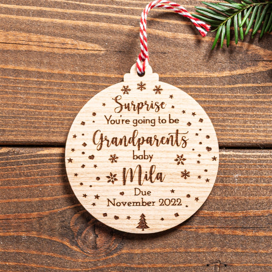 Pregnancy announcement Christmas bauble engraved with “Grandparents to Be” message