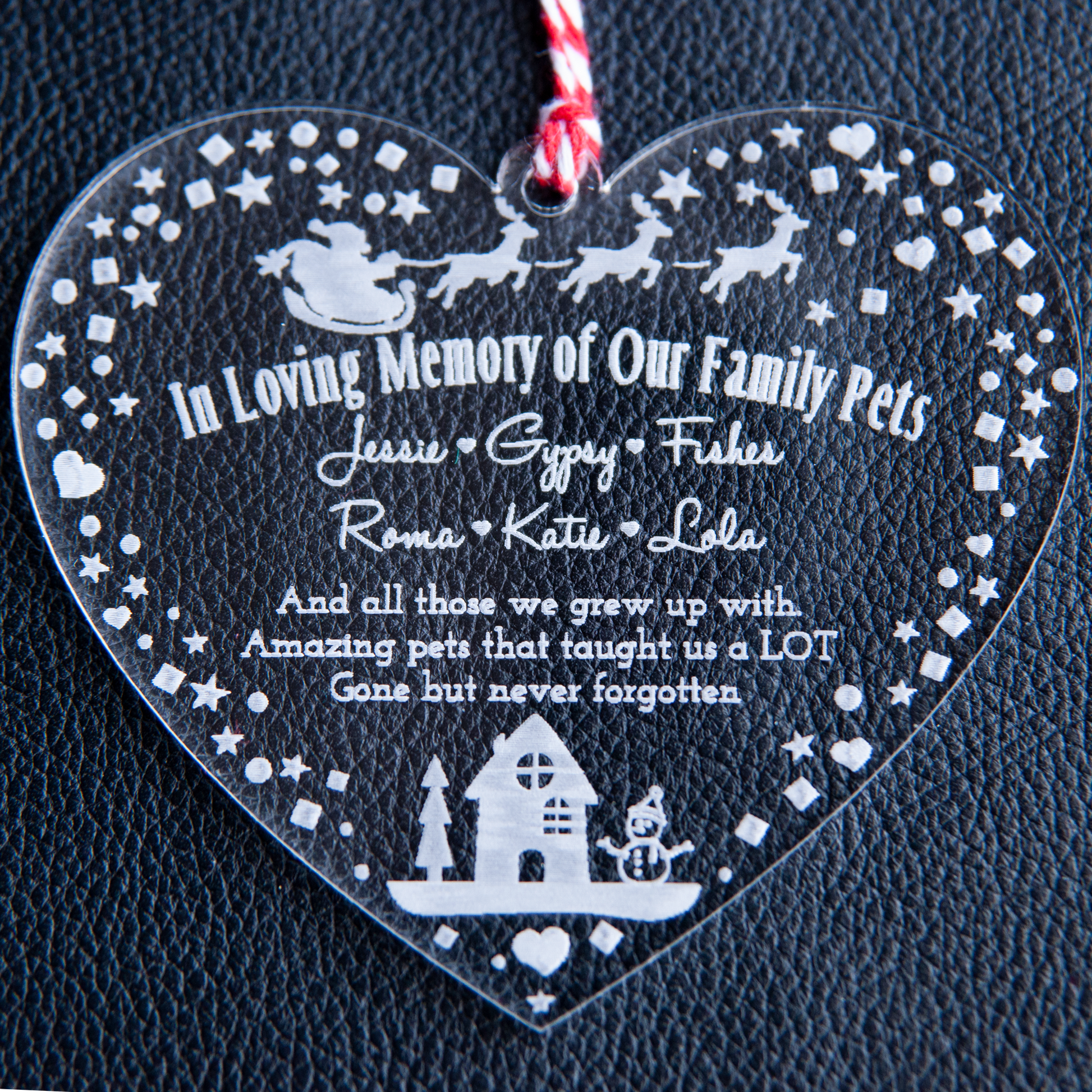 Custom engraved heart-shaped pet remembrance decoration with ribbon