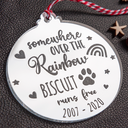 Silver mirror pet memorial ornament reflecting Christmas lights