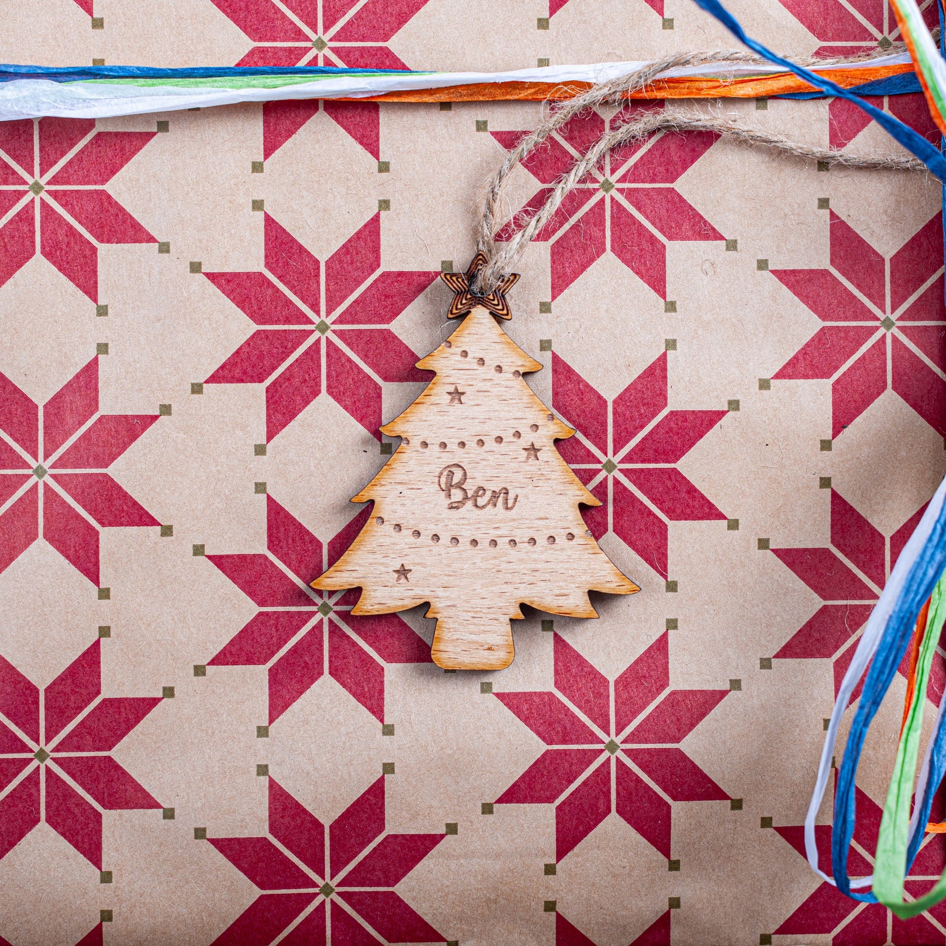 Laser cut acrylic Christmas tree gift tag with engraved name