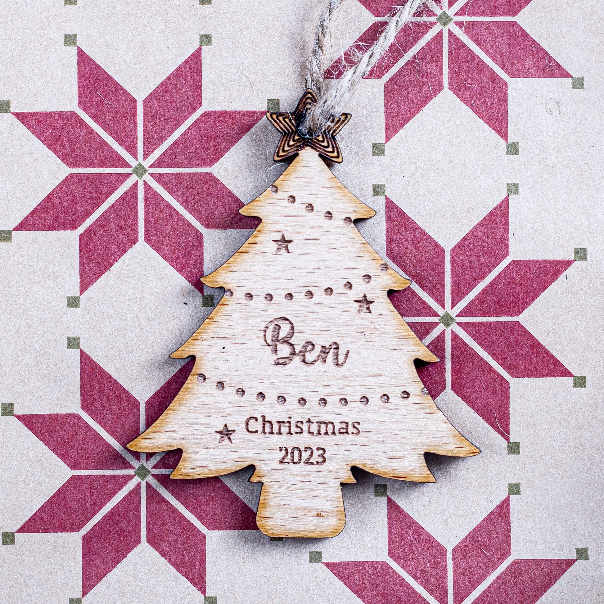 Personalised Christmas tree-shaped gift tag in wood for festive wrapping
