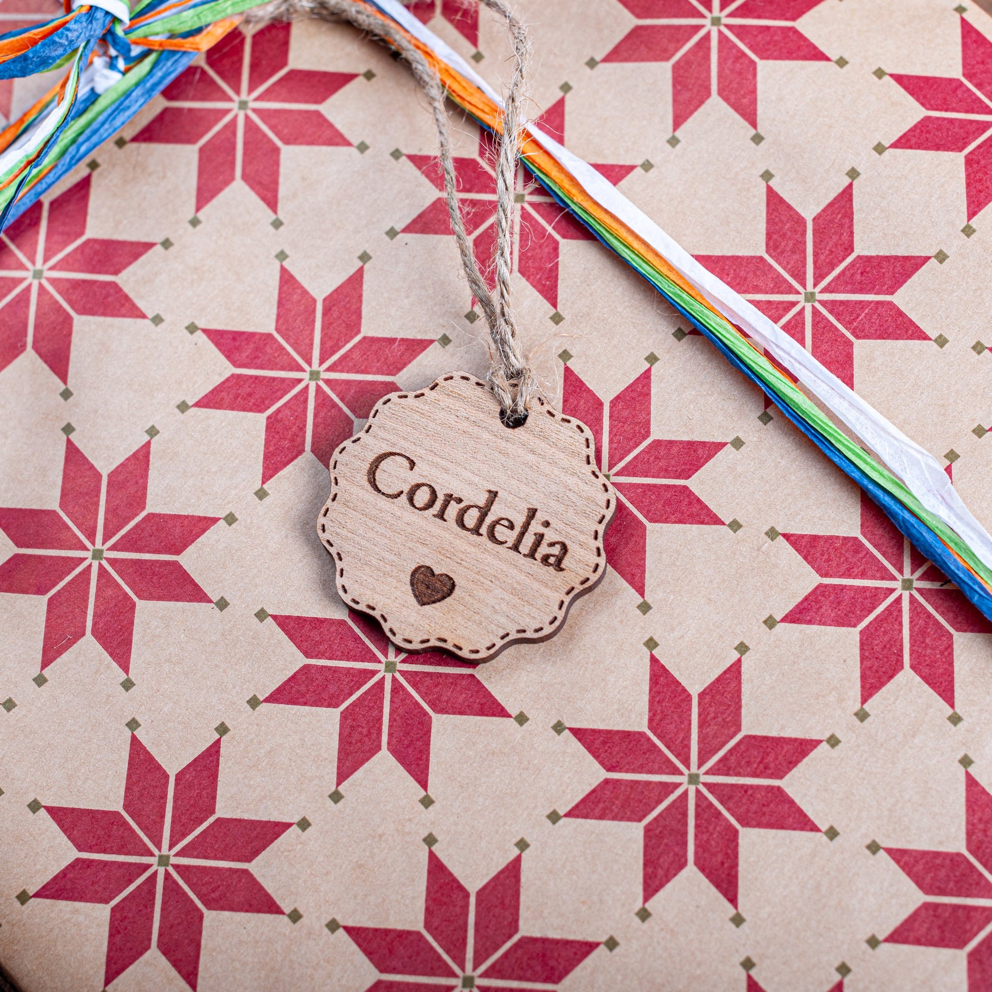 Laser cut bauble gift tag with heart detail and personalised name