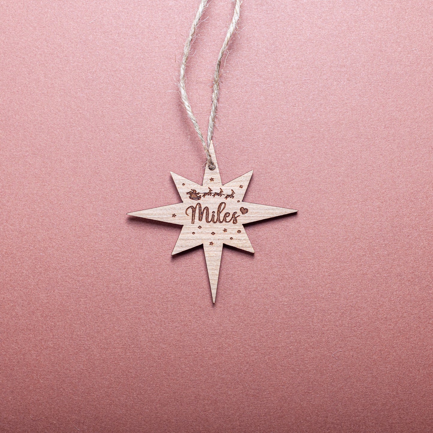 Wooden northern star ornament tag engraved with festive name