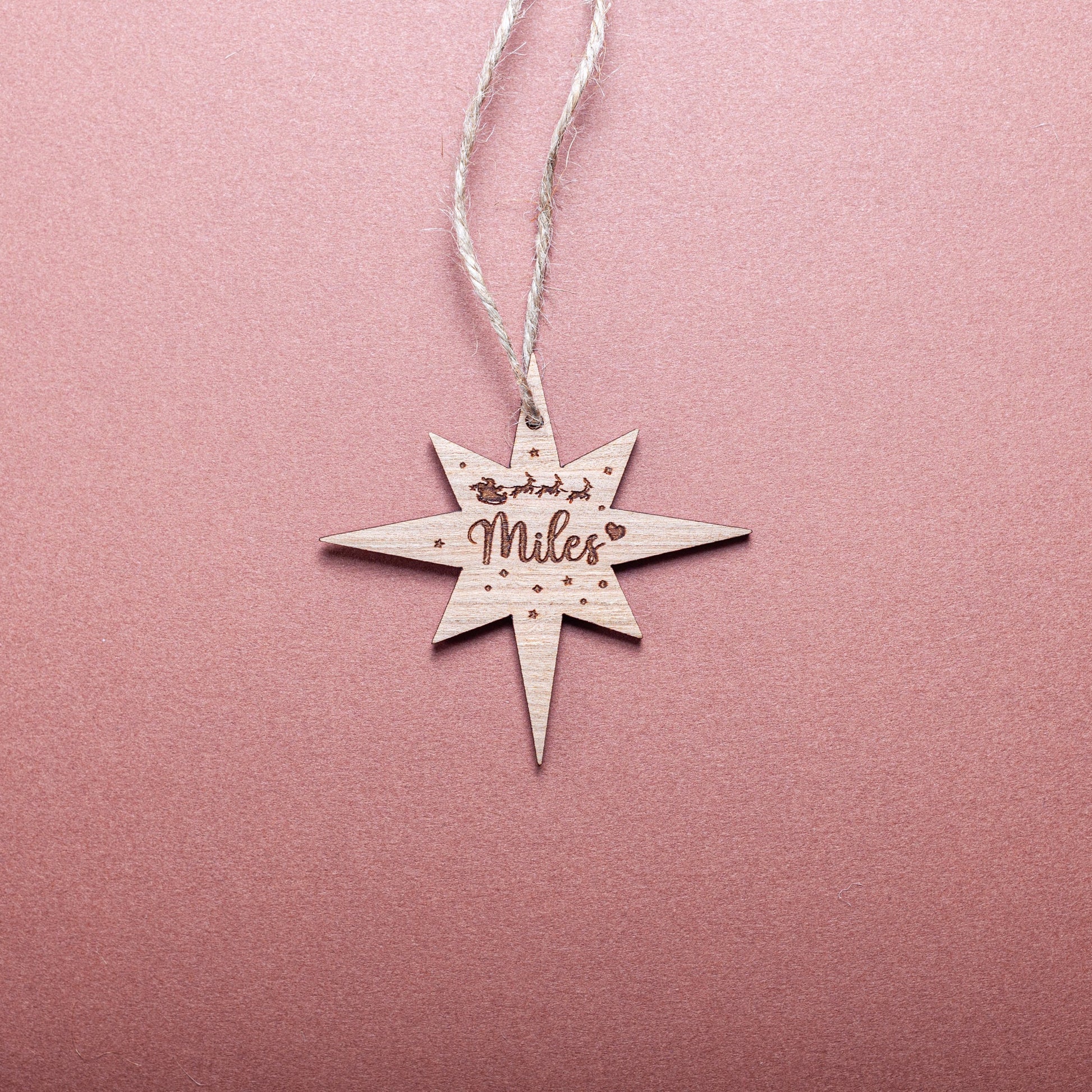 Wooden northern star ornament tag engraved with festive name