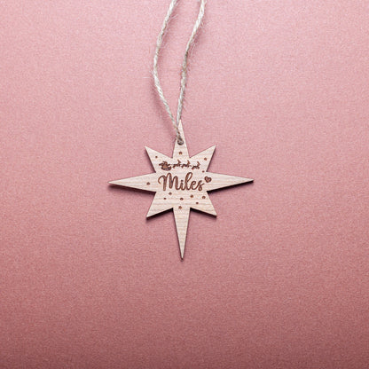 Wooden northern star ornament tag engraved with festive name