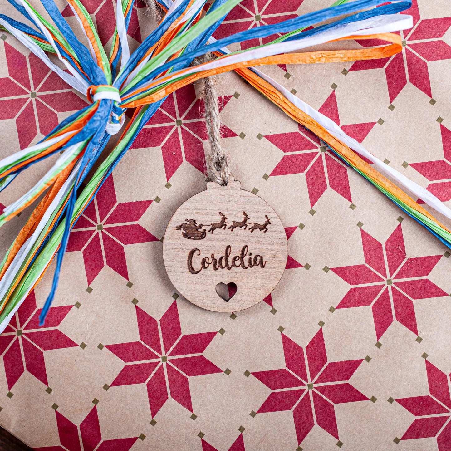 Laser cut acrylic bauble name tag with heart cut-out for festive décor