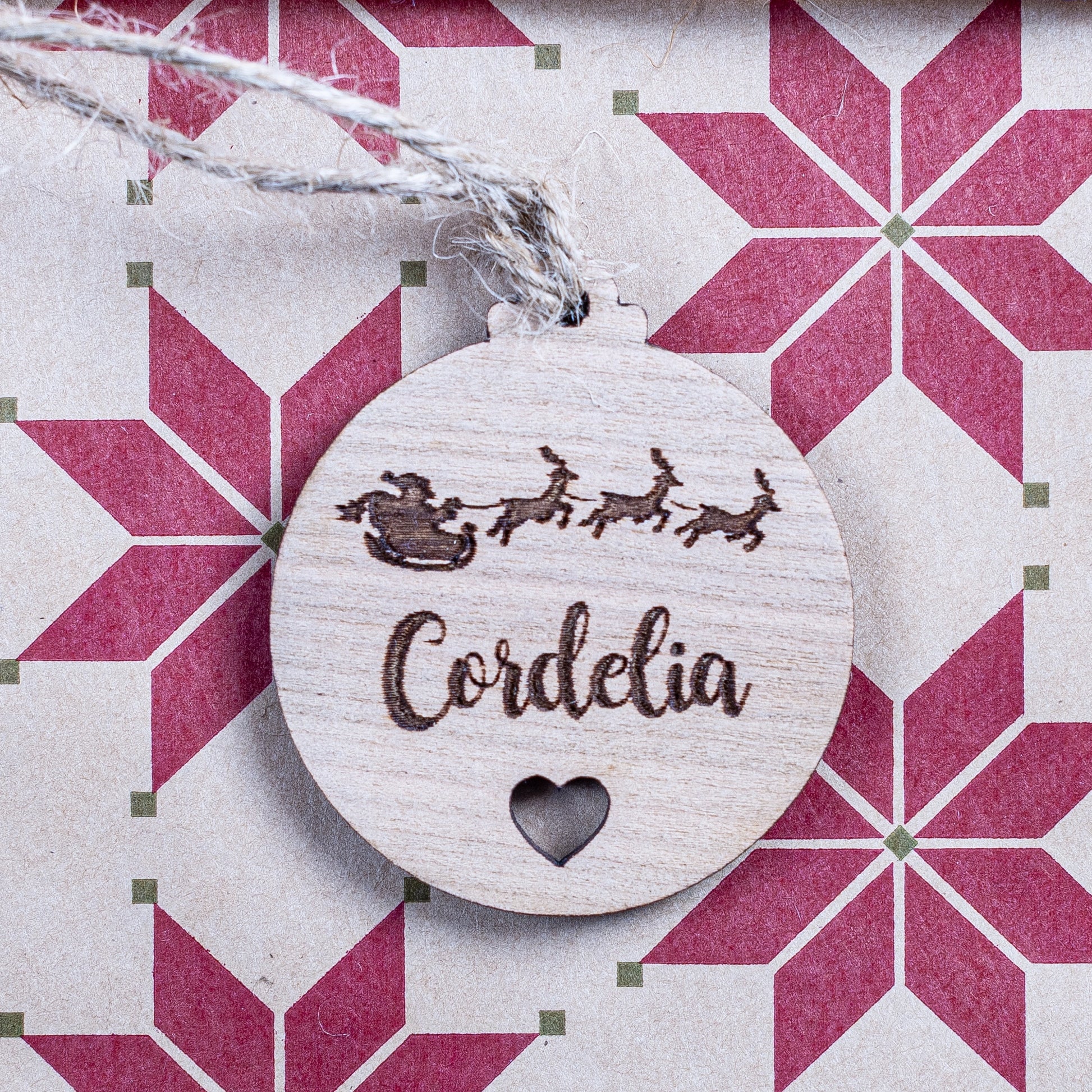 Personalised Christmas bauble gift tag with heart cut-out design