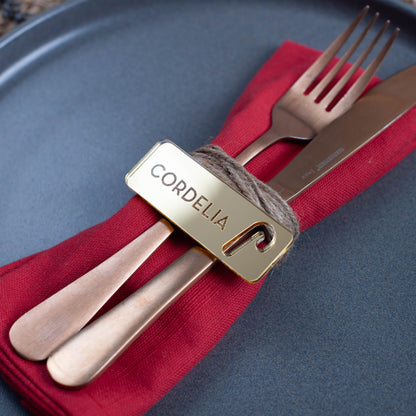 Custom laser cut Christmas place setting with intricate candy cane cutout in gold acrylic