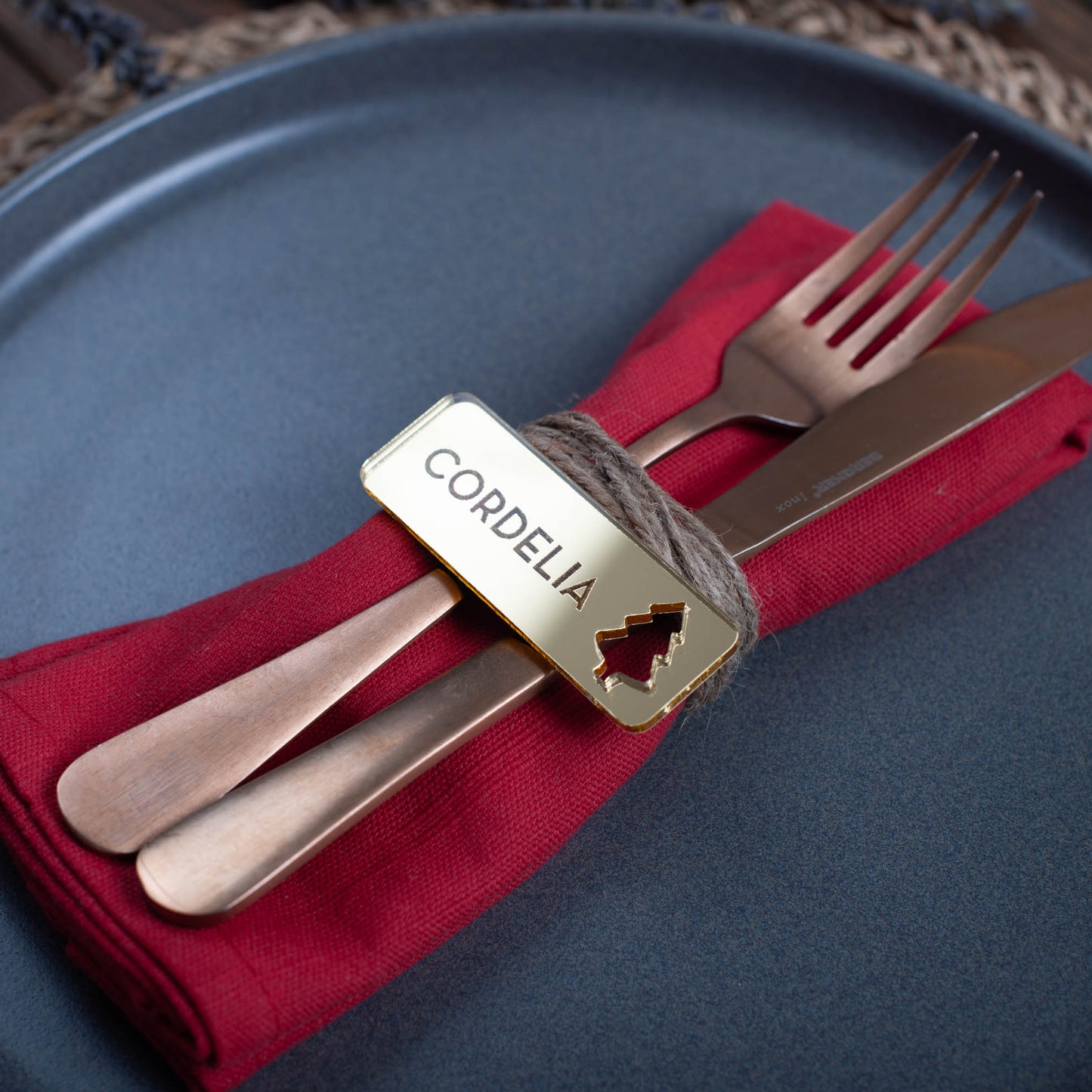 Custom laser cut Christmas place setting with intricate tree cutout in gold acrylic