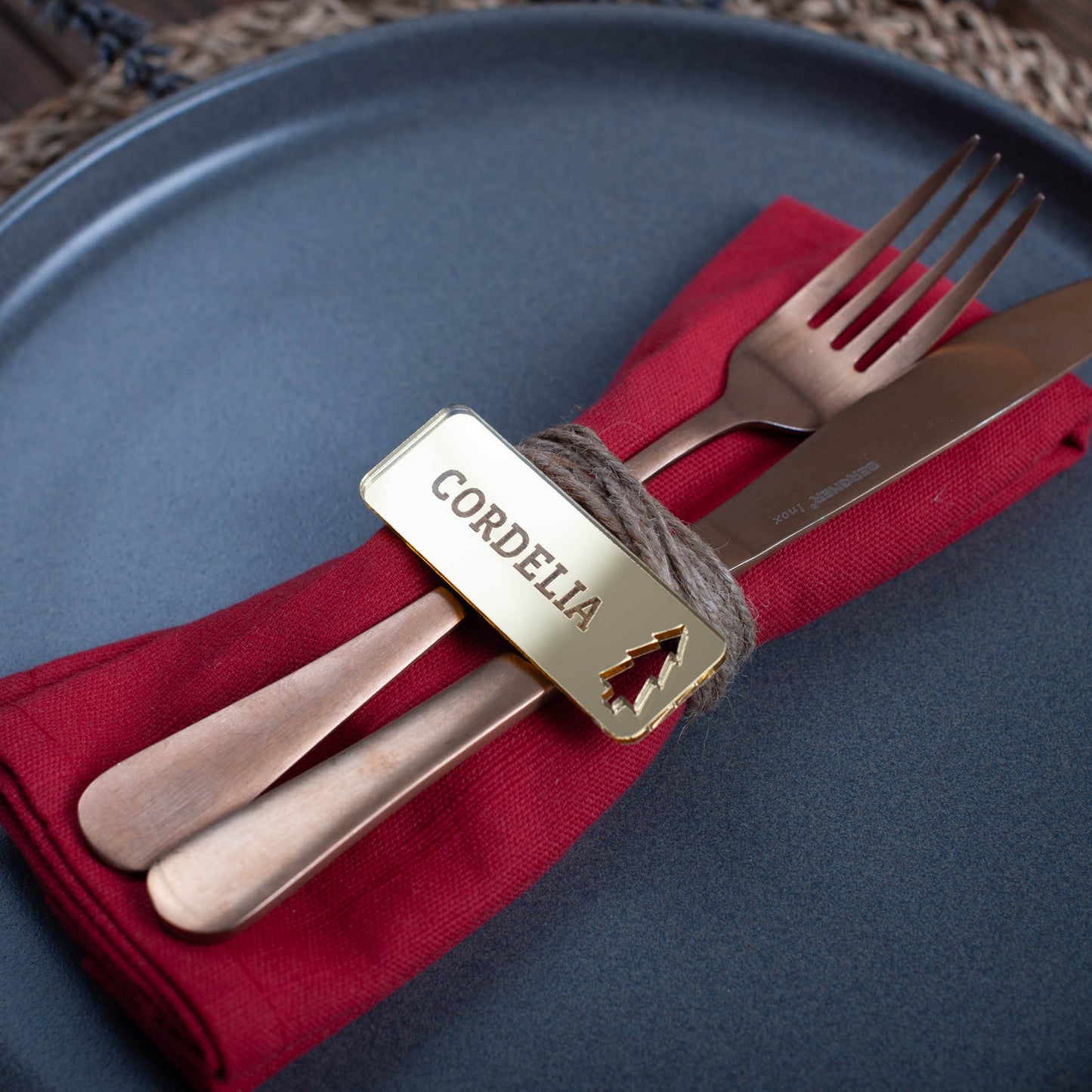 Custom laser cut Christmas place setting with intricate scnadinavian style tree cutout in gold acrylic
