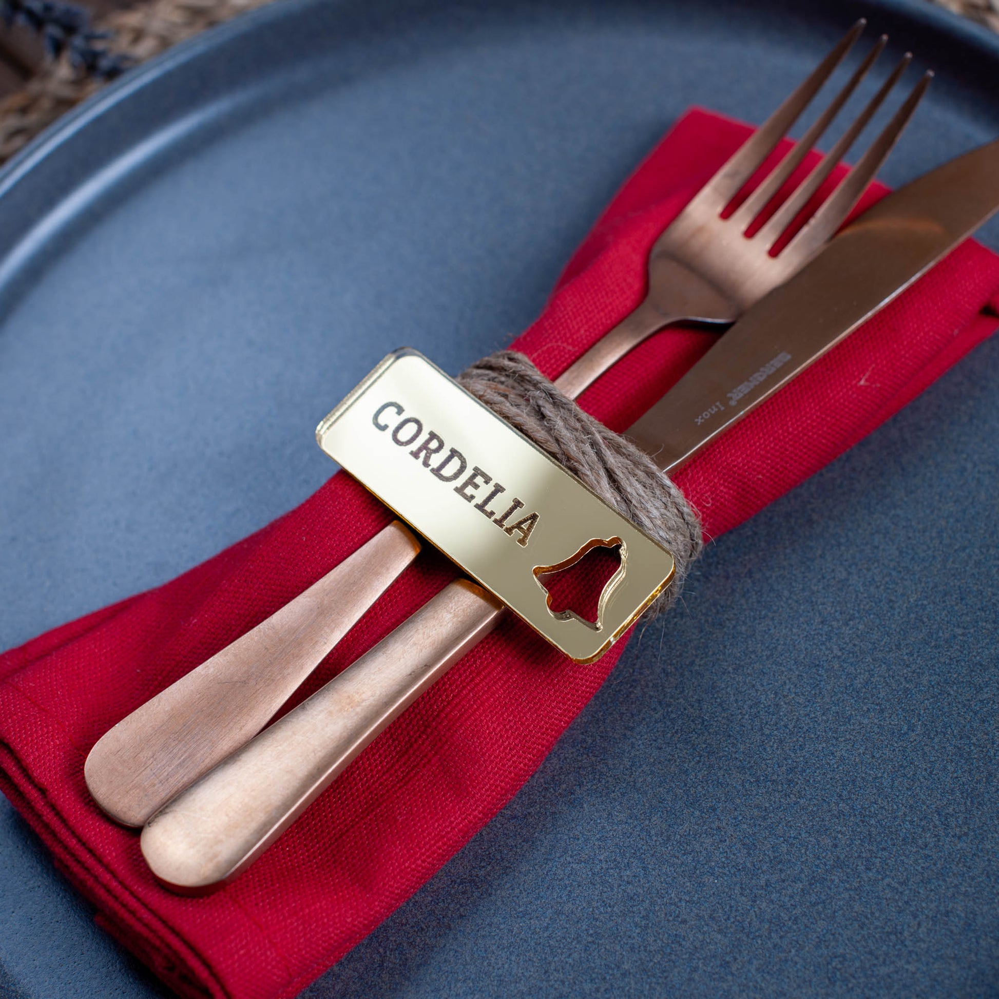 Custom laser cut Christmas place setting with intricate bell cutout in gold acrylic