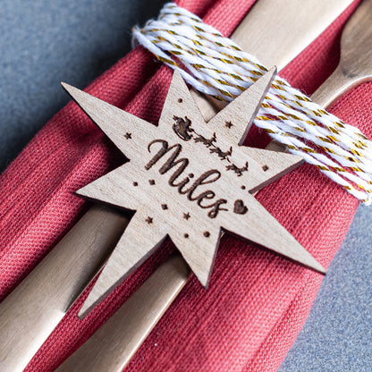 Custom star-shaped name decoration used as Christmas place card