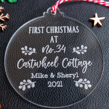 Laser cut acrylic bauble engraved with family name and year