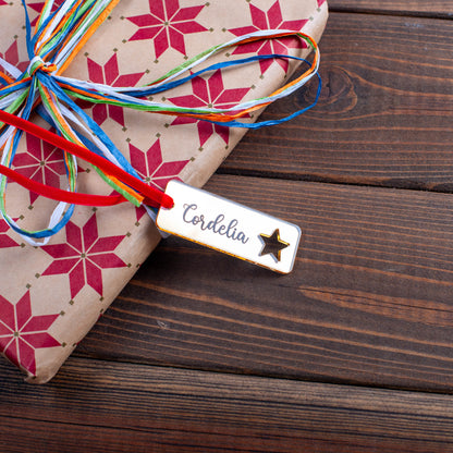 Rustic personalised wood tag with festive ornament cut-out pattern