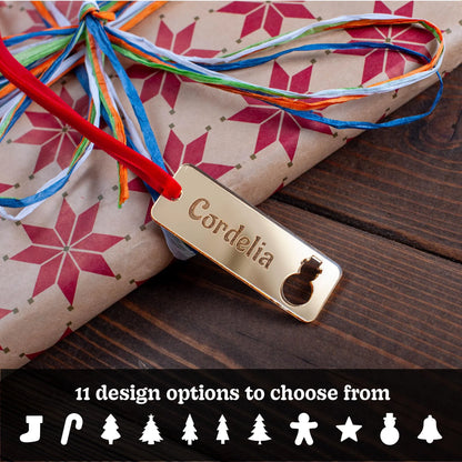 Personalised rectangular wooden Christmas gift tag with festive cut-outs