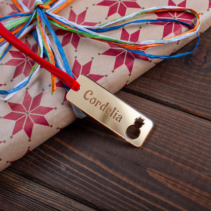 Laser cut wooden rectangle gift tag featuring Christmas ornament cut-outs