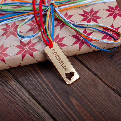 Rustic rectangular wooden Christmas tag with engraved ornament cutout pattern