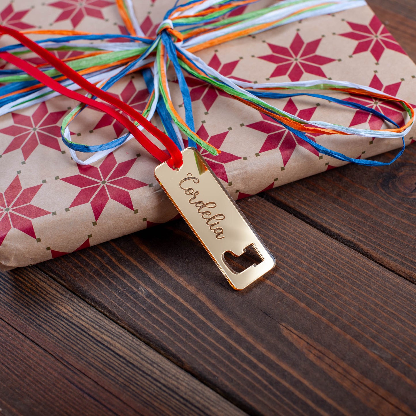 Personalised wooden Christmas tag with laser-cut festive ornament shapes