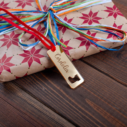 Personalised wooden Christmas tag with laser-cut festive ornament shapes