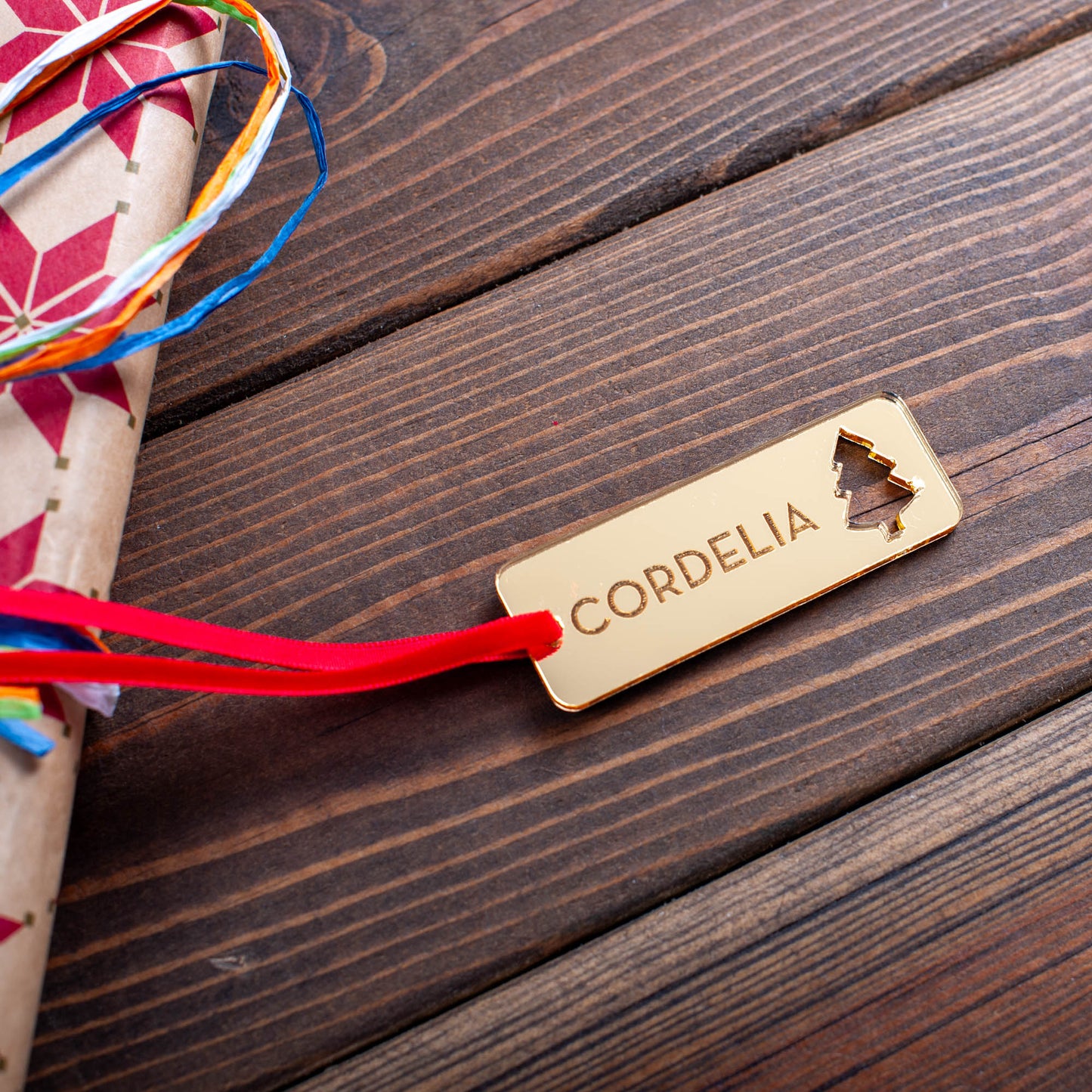 Engraved wooden Christmas tag with ornament design and name engraving