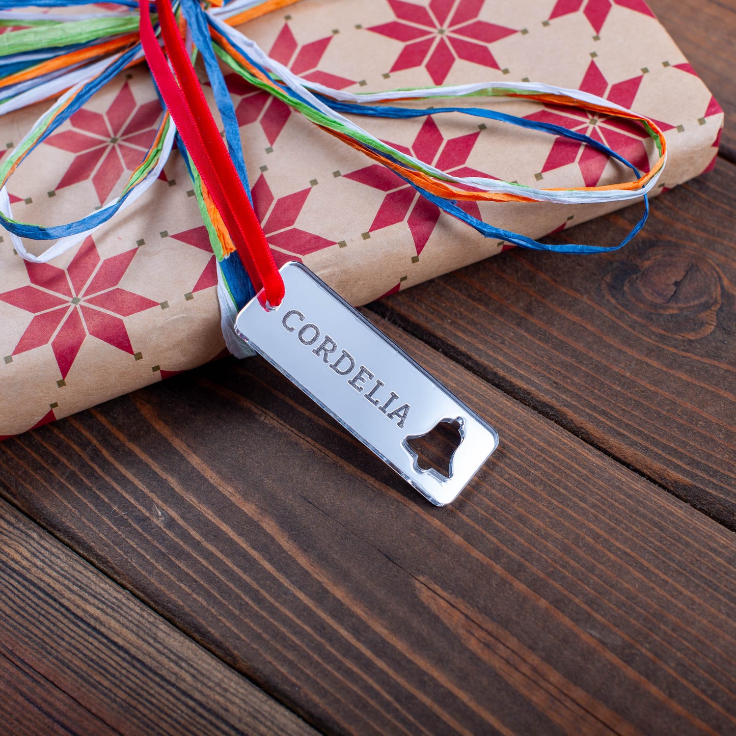 Custom Christmas tag with engraved name and cut-out ornament details