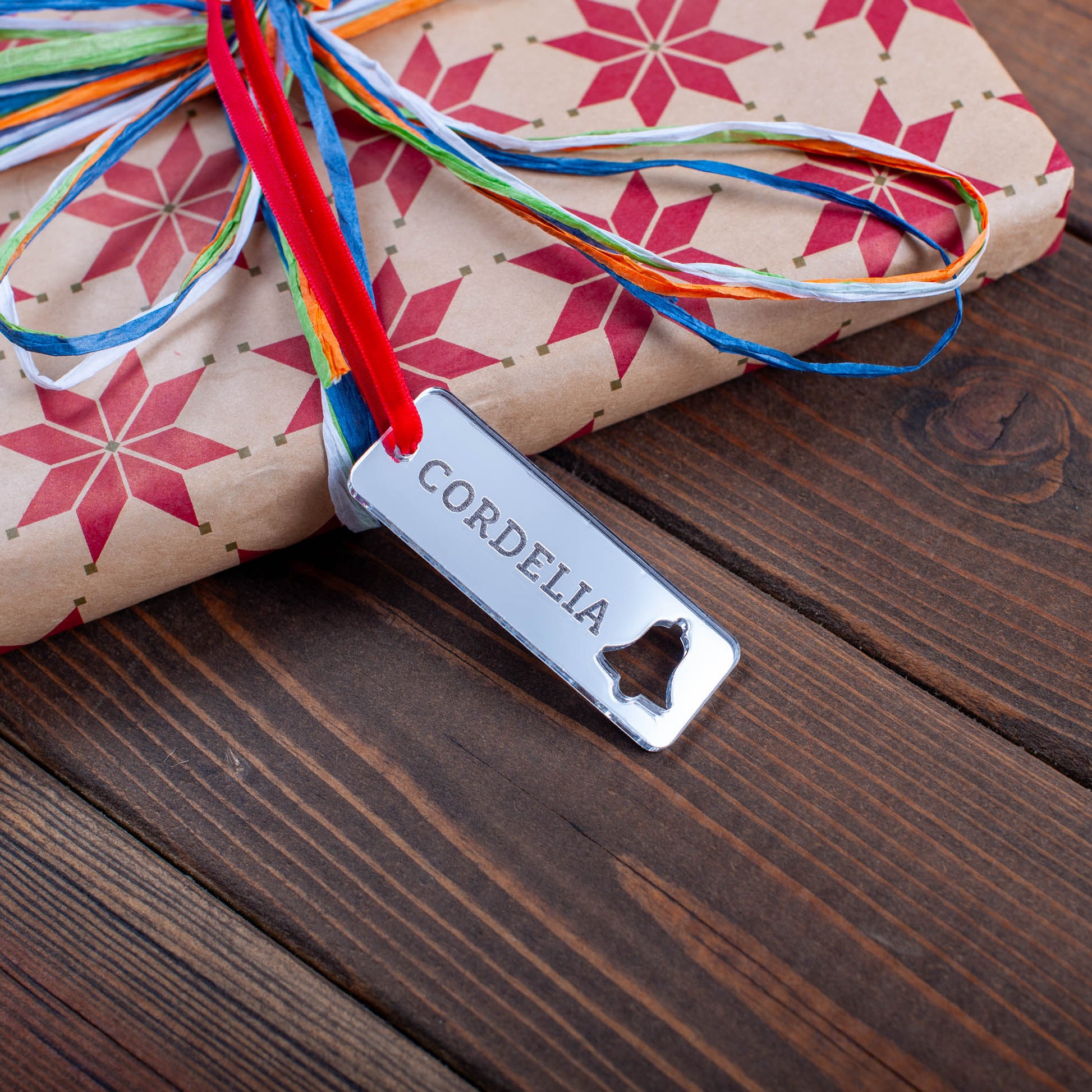 Custom Christmas tag with engraved name and cut-out ornament details