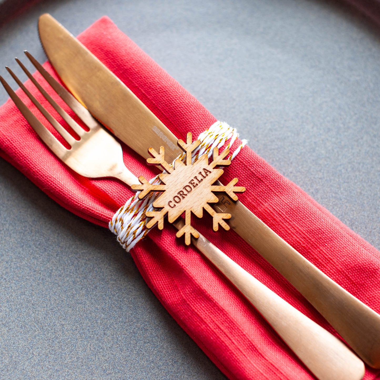 Laser cut snowflake place name ornament for holiday table setting